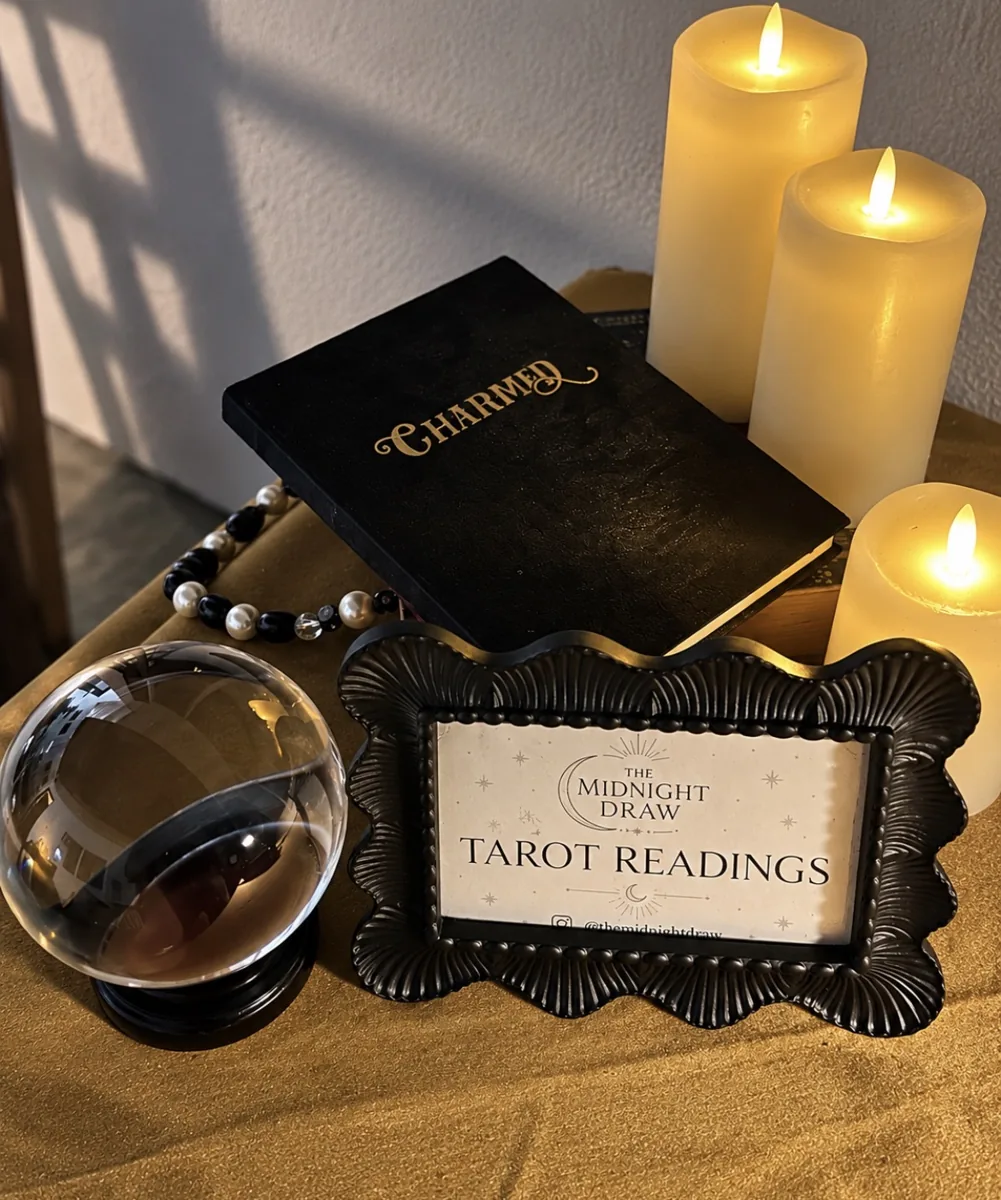 The Midnight Draw framed tarot sign, crystal ball and candlelight on gold velvet